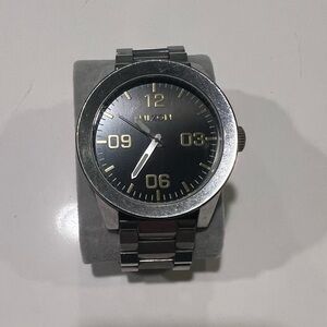 Nixon Silver and Black Watch with Gold Accents